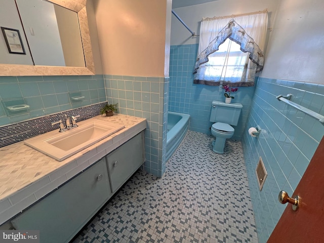 full bathroom with vanity, bathing tub / shower combination, toilet, and tile walls