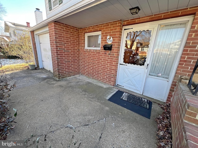 entrance to property featuring a garage