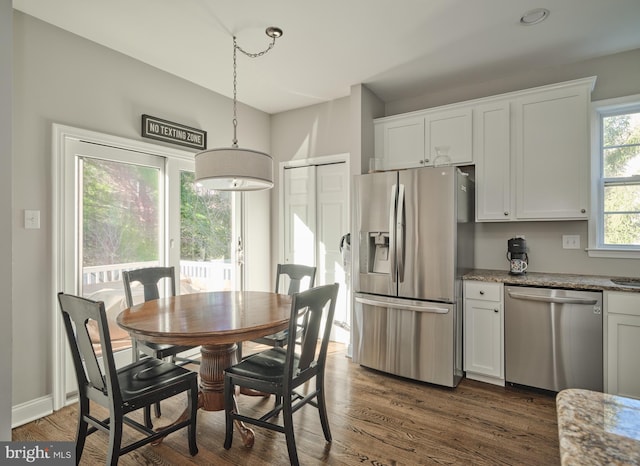 dining area featuring dark hardwood / wood-style floors