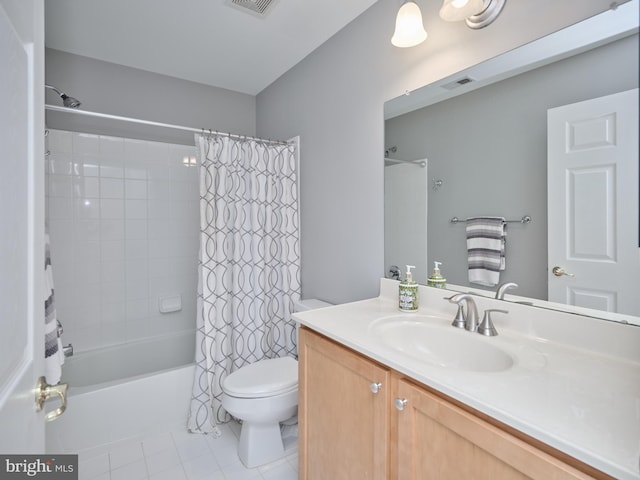 full bathroom featuring tile patterned flooring, shower / bath combo, toilet, and vanity