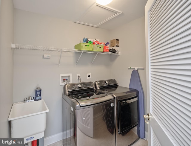 laundry area featuring sink and washer and dryer