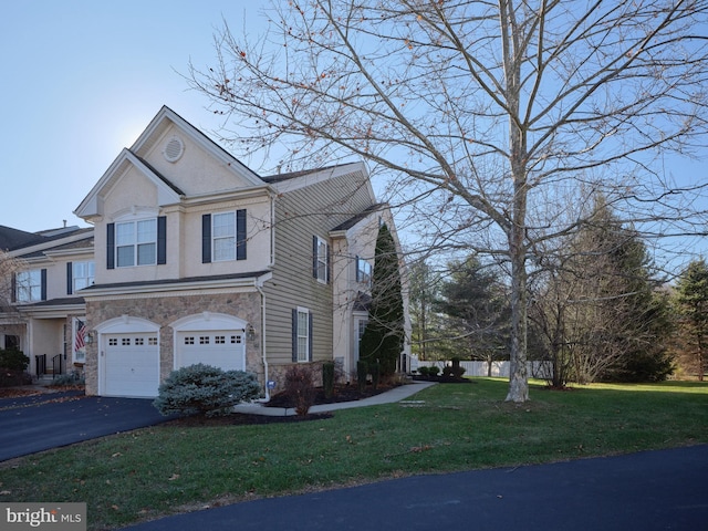 view of property exterior with a yard and a garage