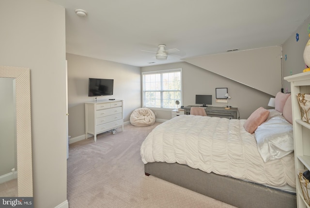 carpeted bedroom with ceiling fan and lofted ceiling