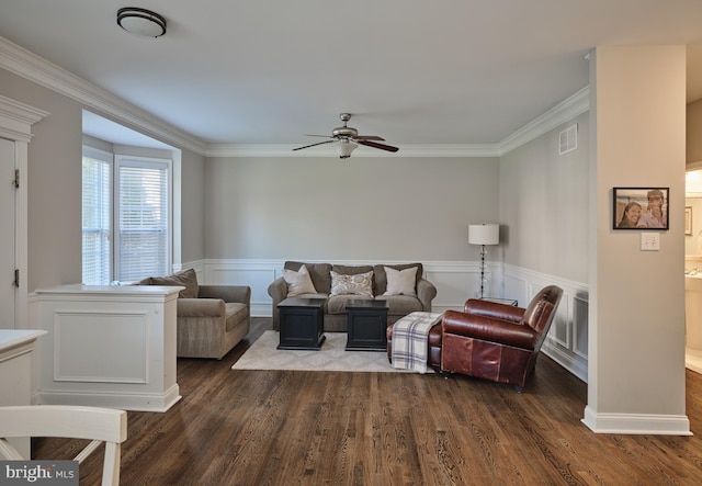 living room with ceiling fan, dark wood-type flooring, and ornamental molding