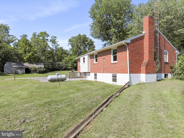 view of property exterior with a deck and a yard