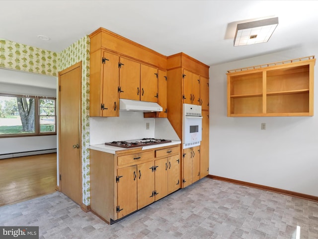 kitchen featuring light wood-type flooring, white appliances, and a baseboard heating unit