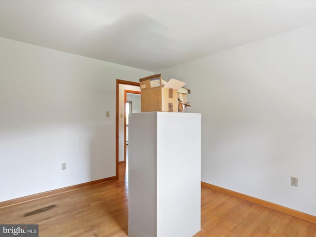 spare room with light wood-type flooring