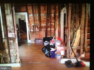 miscellaneous room with hardwood / wood-style flooring