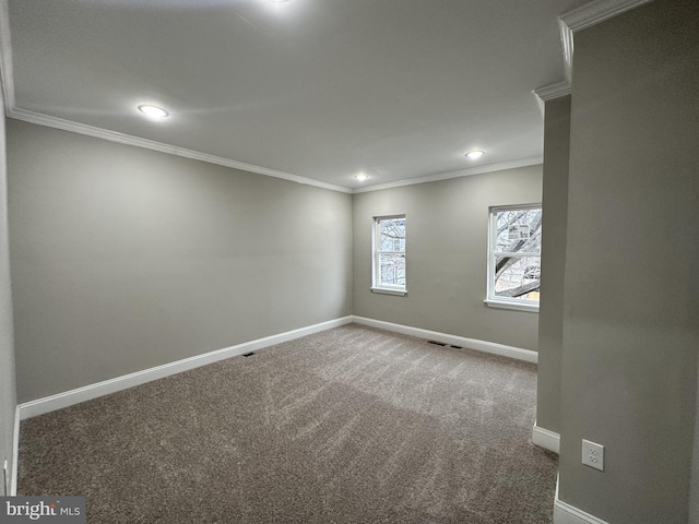 unfurnished room featuring ornamental molding and carpet floors