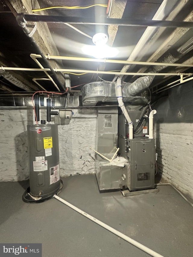 utility room featuring water heater