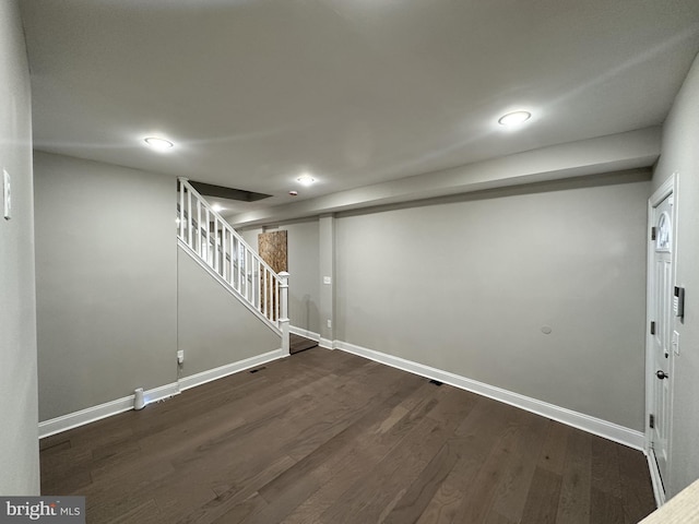 basement with dark wood-type flooring