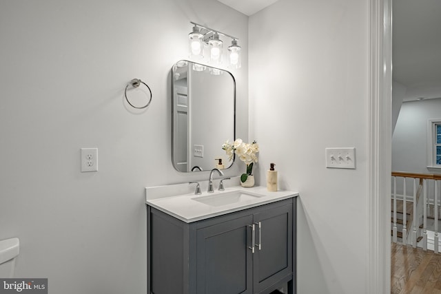 bathroom featuring hardwood / wood-style floors and vanity