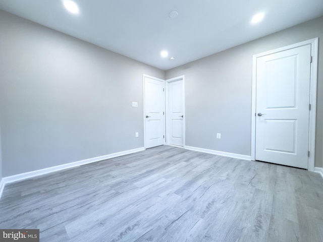 spare room featuring light hardwood / wood-style floors