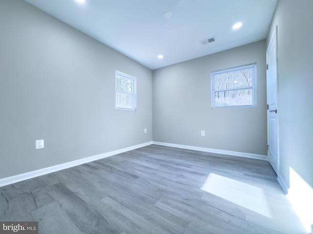 empty room featuring hardwood / wood-style flooring