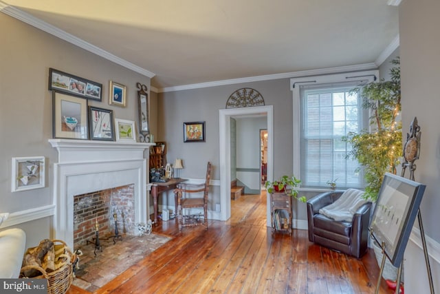 sitting room featuring crown molding and wood-type flooring