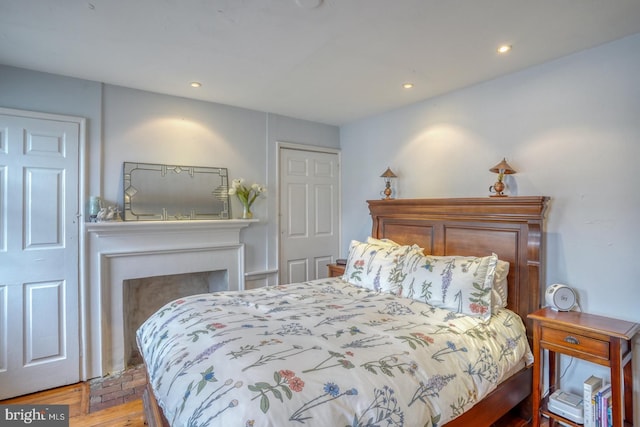 bedroom with hardwood / wood-style flooring