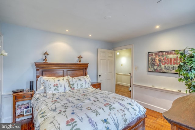 bedroom with light wood-type flooring