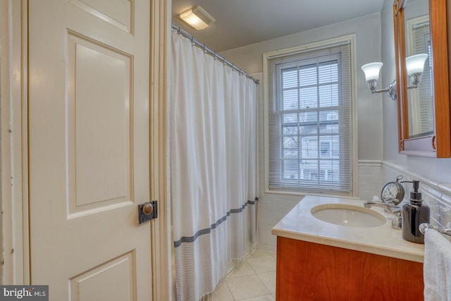 bathroom with tile patterned flooring and vanity