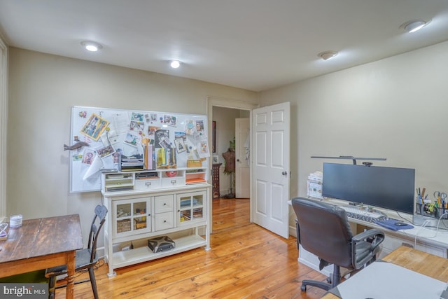 home office featuring light hardwood / wood-style floors