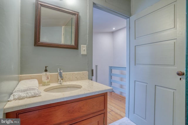 bathroom with vanity and hardwood / wood-style flooring