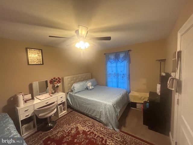 carpeted bedroom with ceiling fan