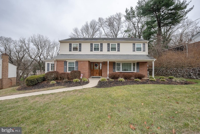 front facade featuring a front lawn