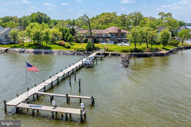 dock area featuring a water view and a yard