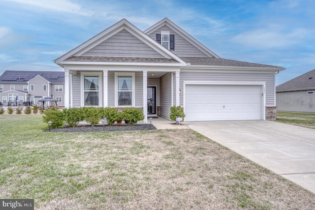 view of front of home with a garage and a front lawn