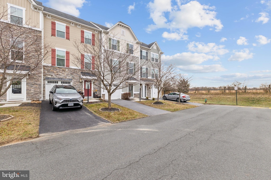 townhome / multi-family property featuring a garage