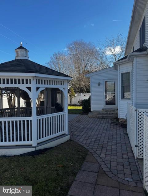 exterior space with a gazebo and a patio