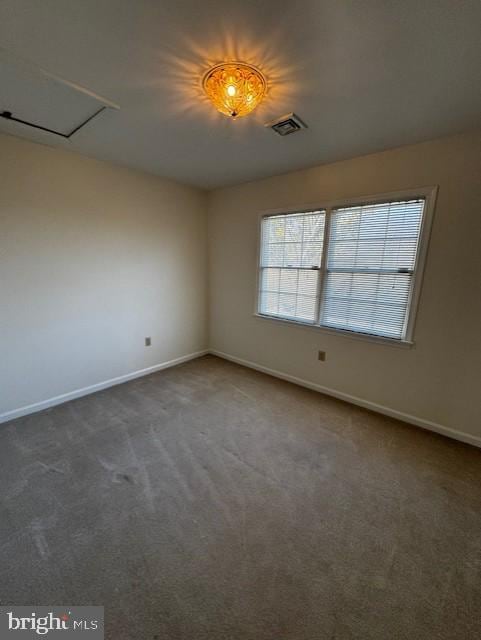 empty room featuring dark carpet