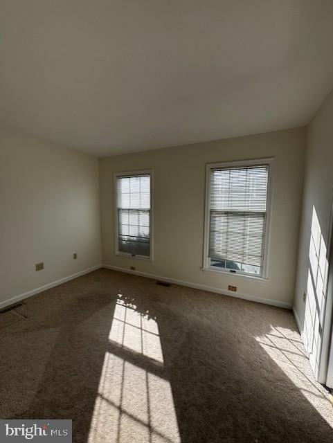 unfurnished room with carpet floors