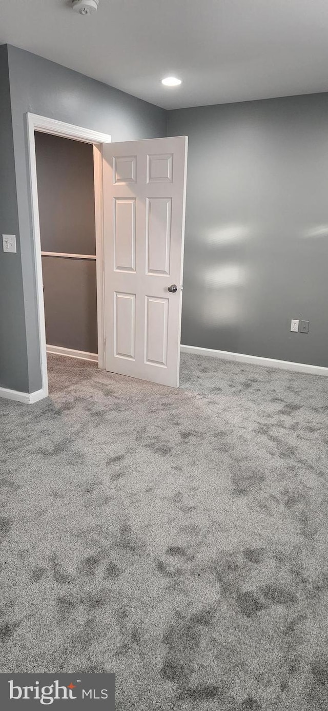 unfurnished bedroom with carpet