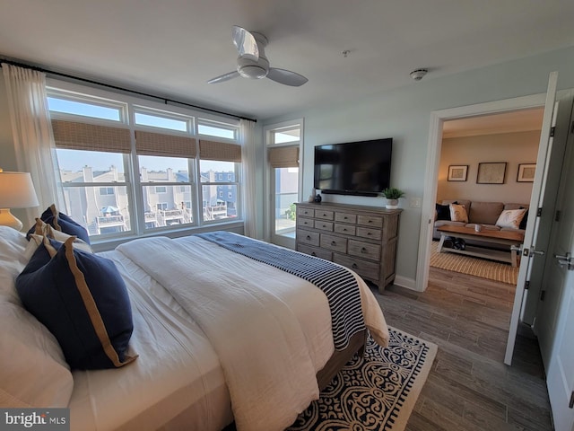 bedroom featuring ceiling fan and dark hardwood / wood-style floors