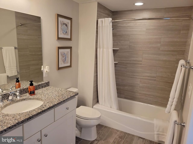 full bathroom featuring vanity, toilet, and shower / tub combo