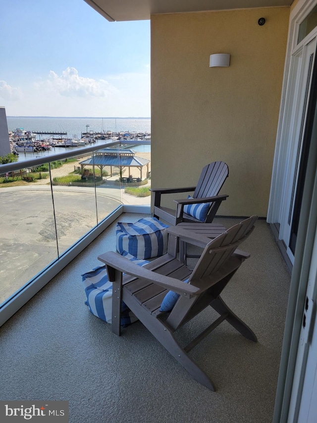 balcony featuring a water view