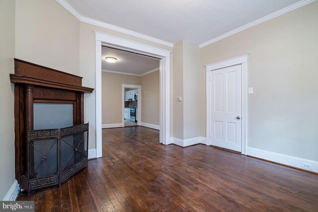 unfurnished living room with crown molding and dark wood-type flooring