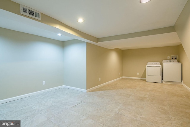 basement featuring washer and dryer