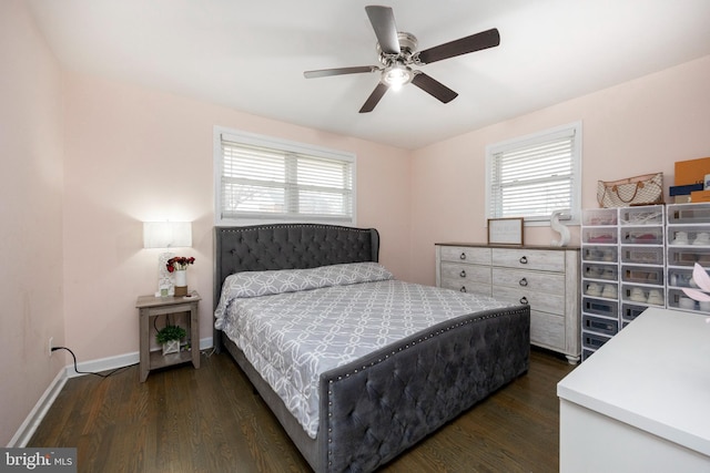 bedroom with dark hardwood / wood-style floors and ceiling fan