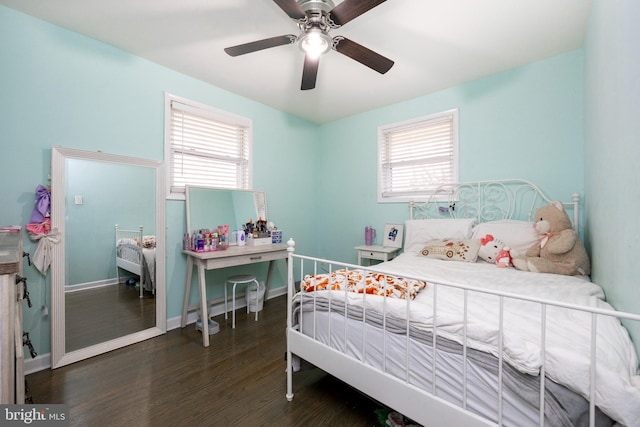 bedroom with ceiling fan and dark wood-type flooring