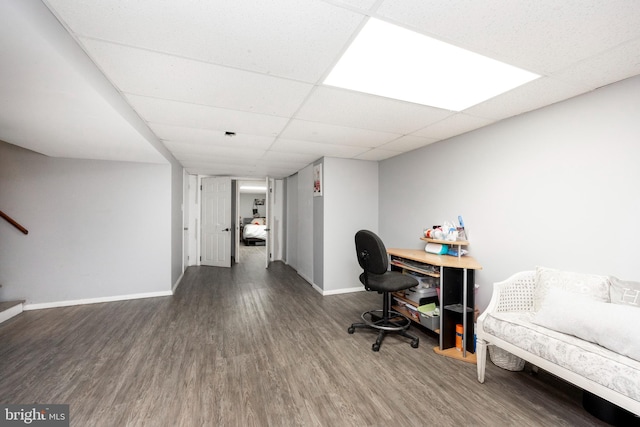 home office featuring hardwood / wood-style flooring and a drop ceiling