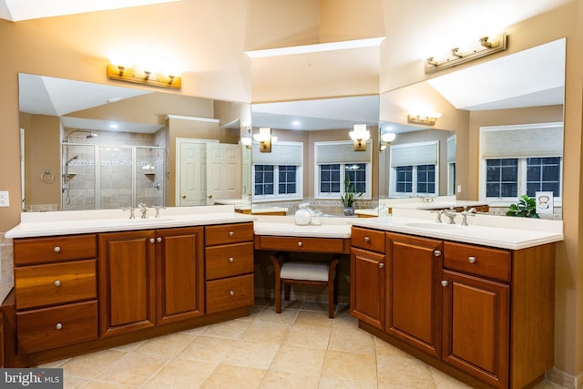 bathroom with tile patterned floors, vanity, and an enclosed shower