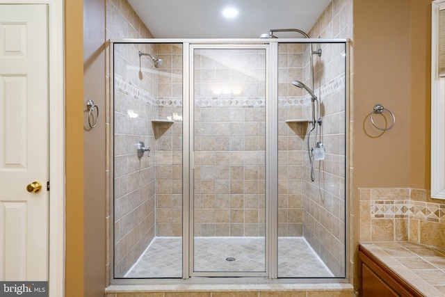 bathroom with a shower with shower door