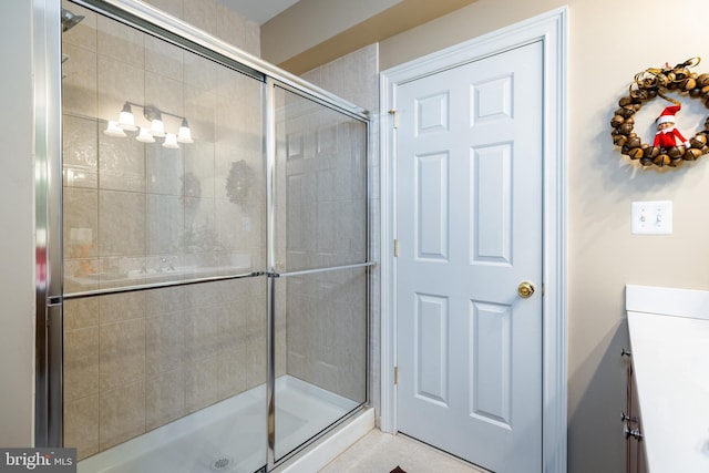 bathroom with vanity, tile patterned floors, and an enclosed shower