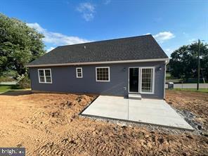 back of house with a patio