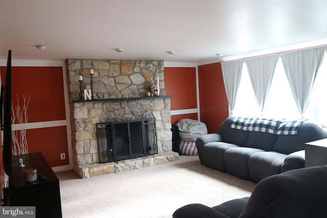 carpeted living room with a fireplace and crown molding