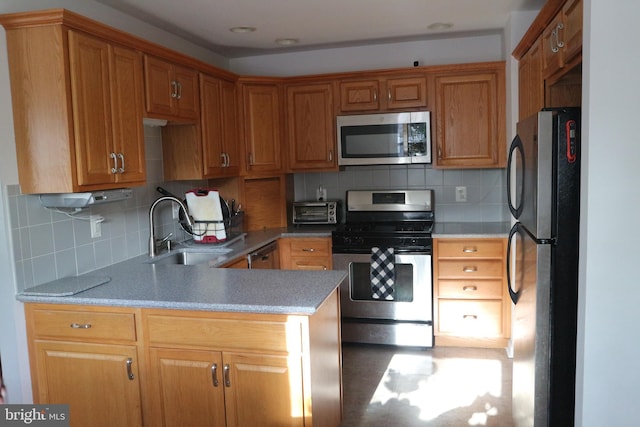 kitchen with tasteful backsplash, sink, and appliances with stainless steel finishes