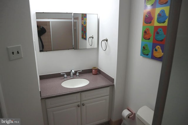 bathroom with vanity and toilet