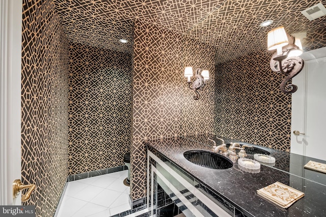 bathroom with sink, tile walls, and tile patterned floors