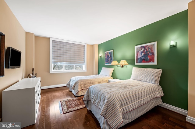 bedroom featuring dark hardwood / wood-style flooring